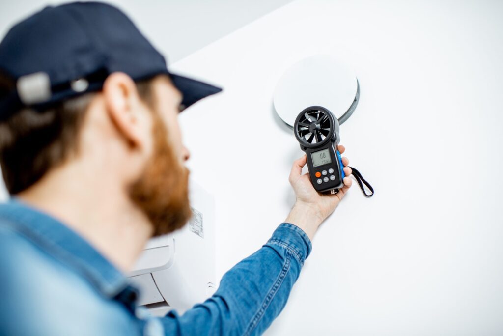 handyman checking of air ventilation 2021 11 01 21 57 24 utc scaled